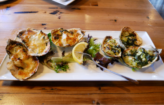 Baked Cheesy Oysters Topped with Lemon Sauce and Spinach